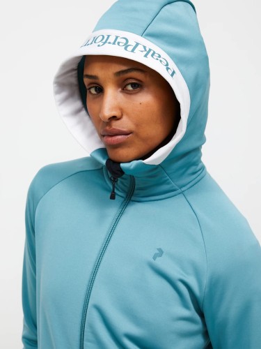 bluza-damska-peak-performance-rider-essentials-zip-hood-deluded-vision-kaptur