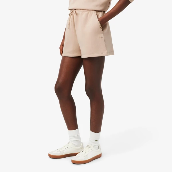 Beżowe dresowe spodenki Damskie Lacoste 